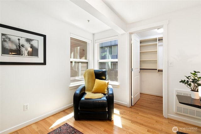 418 11th Ave E Unit B, Seattle, WA 98102 - sitting room with light wood-type flooring, heating unit, and baseboards