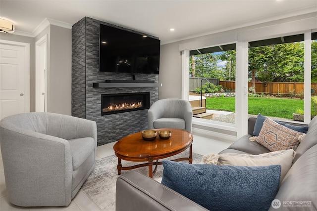 tiled living area with ornamental molding, a fireplace, and recessed lighting