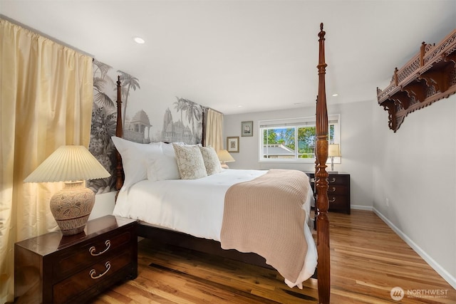 bedroom featuring light wood-style flooring and baseboards