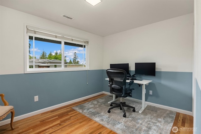 office featuring wood finished floors and baseboards