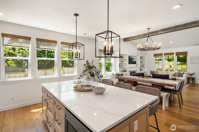 kitchen with a breakfast bar area, baseboards, a chandelier, recessed lighting, and light wood-type flooring
