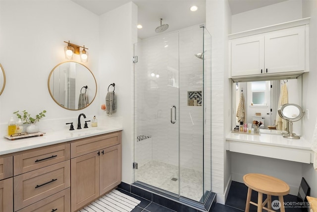 bathroom featuring a stall shower, tile patterned floors, recessed lighting, and vanity
