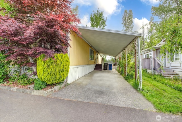 415 Lake View Rd Unit K8, Lynnwood, WA 98087 - view of parking / parking lot featuring an attached carport and asphalt driveway