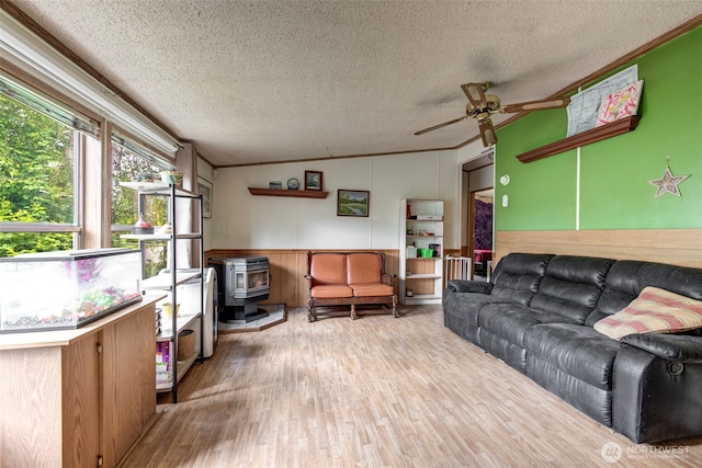 415 Lake View Rd Unit K8, Lynnwood, WA 98087 - living area with a textured ceiling, ceiling fan, wood finished floors, crown molding, and a wainscoted wall