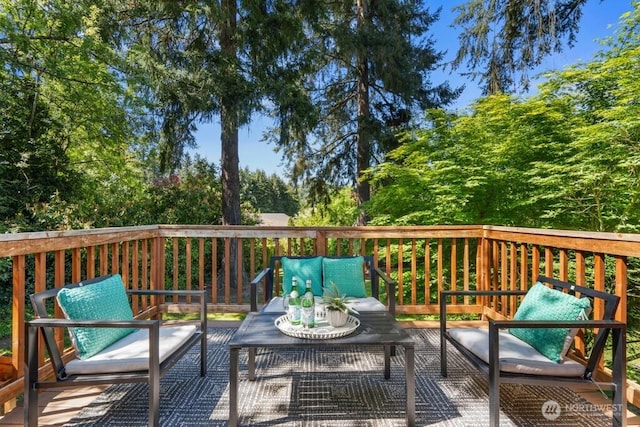 wooden terrace featuring outdoor lounge area
