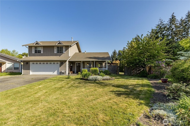 traditional home with asphalt driveway, a porch, and a garage