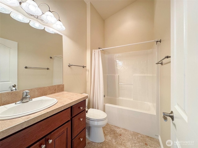 bathroom featuring toilet, shower / bathtub combination with curtain, and vanity