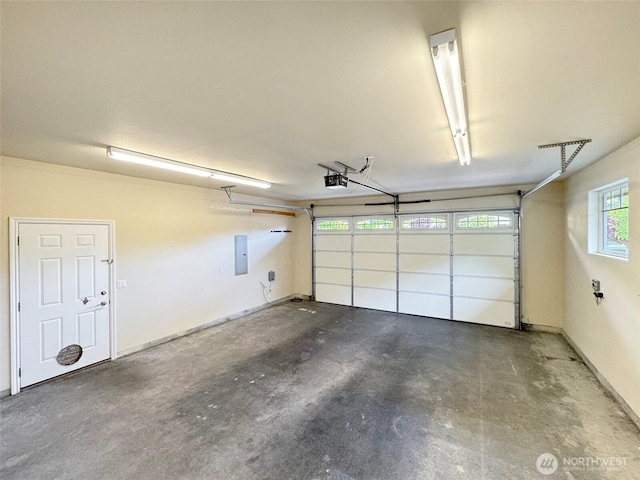 garage featuring electric panel and a garage door opener
