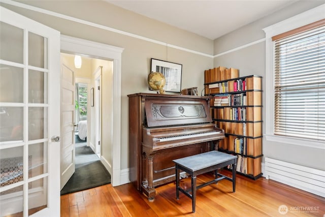 sitting room with wood finished floors and baseboards