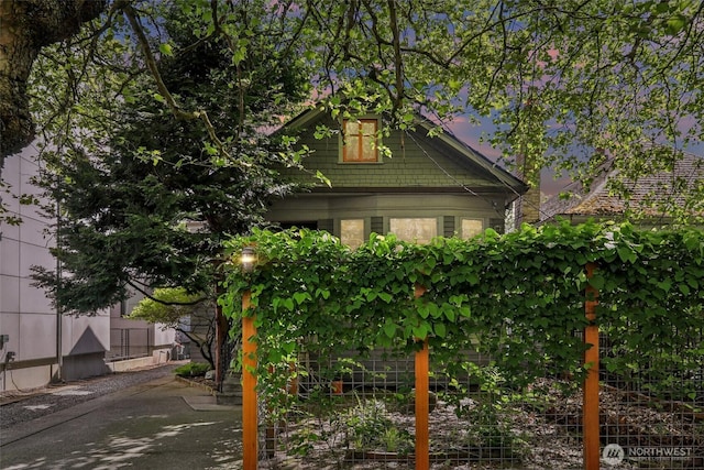 view of side of property featuring fence