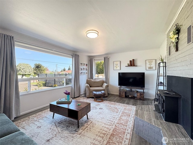 living area featuring wood finished floors and baseboards