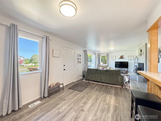 living room featuring light wood-style flooring and baseboards