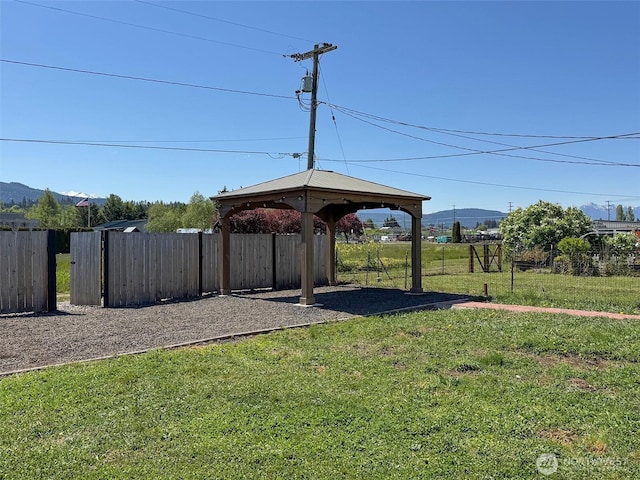 view of yard featuring a gazebo and a mountain view