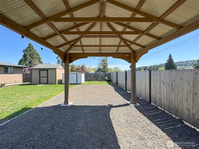 view of patio / terrace with a storage unit, a gazebo, and an outdoor structure