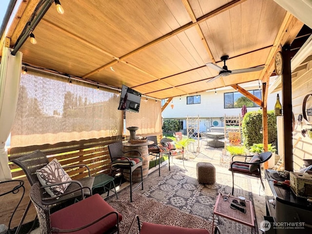 view of patio with ceiling fan and outdoor dining area