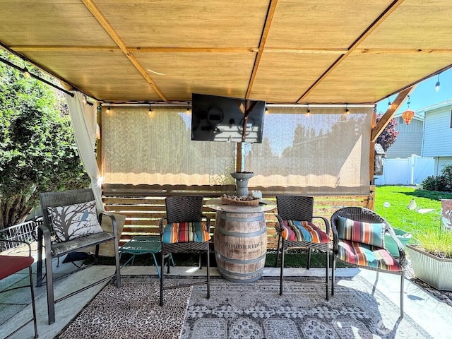 view of patio / terrace featuring fence
