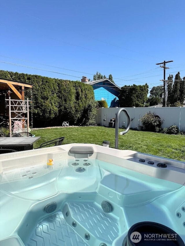 exterior view of fence and a jacuzzi