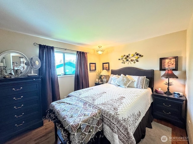 bedroom featuring dark wood-style flooring