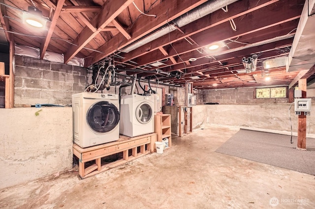 basement with washing machine and clothes dryer