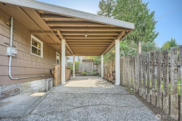 view of patio featuring fence