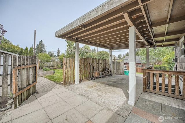 view of patio / terrace with fence and a gate