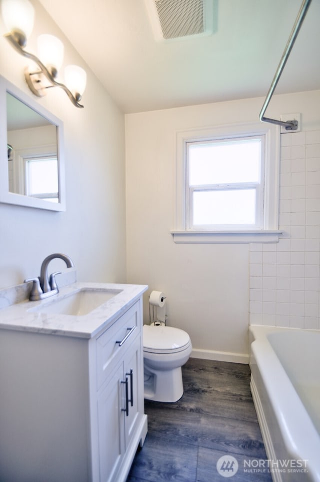 819 Decatur St SW, Olympia, WA 98502 - bathroom featuring vanity, a wealth of natural light, visible vents, and toilet