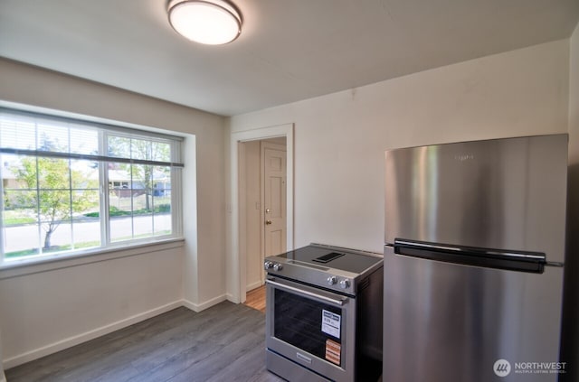 819 Decatur St SW, Olympia, WA 98502 - kitchen featuring baseboards, appliances with stainless steel finishes, and wood finished floors