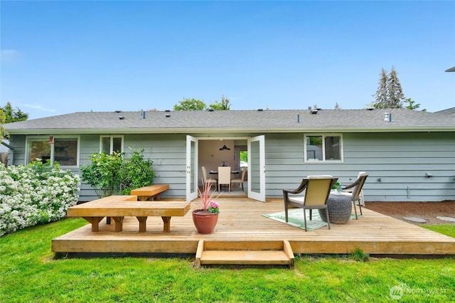 rear view of property with a wooden deck