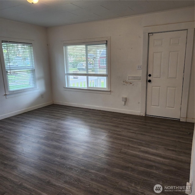 705 E 54th St, Tacoma, WA 98404 - unfurnished room featuring plenty of natural light, dark wood-style flooring, and baseboards