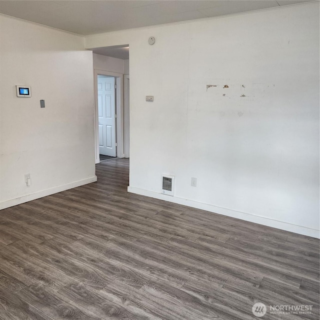 705 E 54th St, Tacoma, WA 98404 - spare room with baseboards and dark wood-style flooring