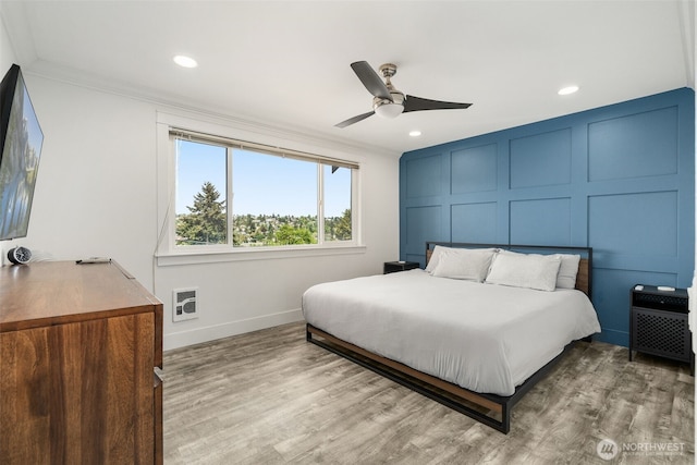 716 W Argand St Unit C, Seattle, WA 98119 - bedroom with ornamental molding, baseboards, recessed lighting, wood finished floors, and a decorative wall