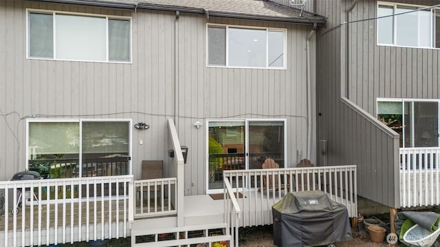 716 W Argand St Unit C, Seattle, WA 98119 - back of house featuring a wooden deck and roof with shingles