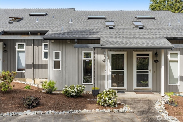 716 W Argand St Unit C, Seattle, WA 98119 - view of front of house featuring roof with shingles and board and batten siding