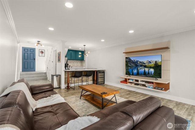 716 W Argand St Unit C, Seattle, WA 98119 - living area featuring wine cooler, wood finished floors, crown molding, baseboards, and recessed lighting