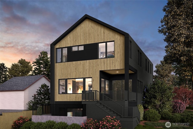 contemporary house with stairway and covered porch