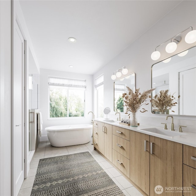 full bathroom featuring double vanity, tile patterned floors, a shower stall, a freestanding bath, and recessed lighting