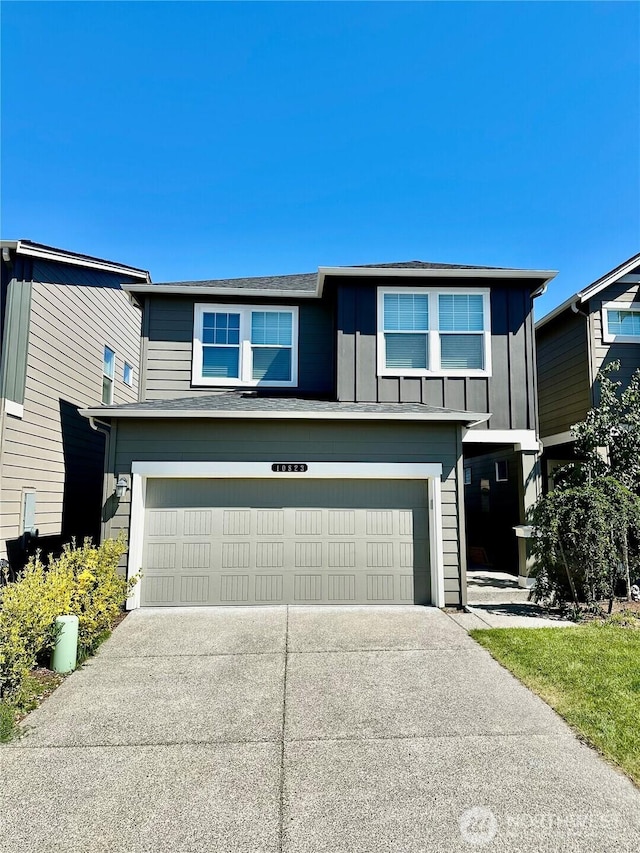 10823 187th Street Ct E, Puyallup, WA 98374 - traditional-style home with an attached garage, concrete driveway, and board and batten siding