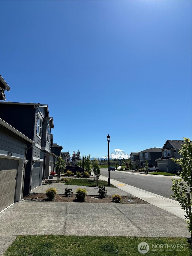 10823 187th Street Ct E, Puyallup, WA 98374 - view of yard featuring a residential view and concrete driveway