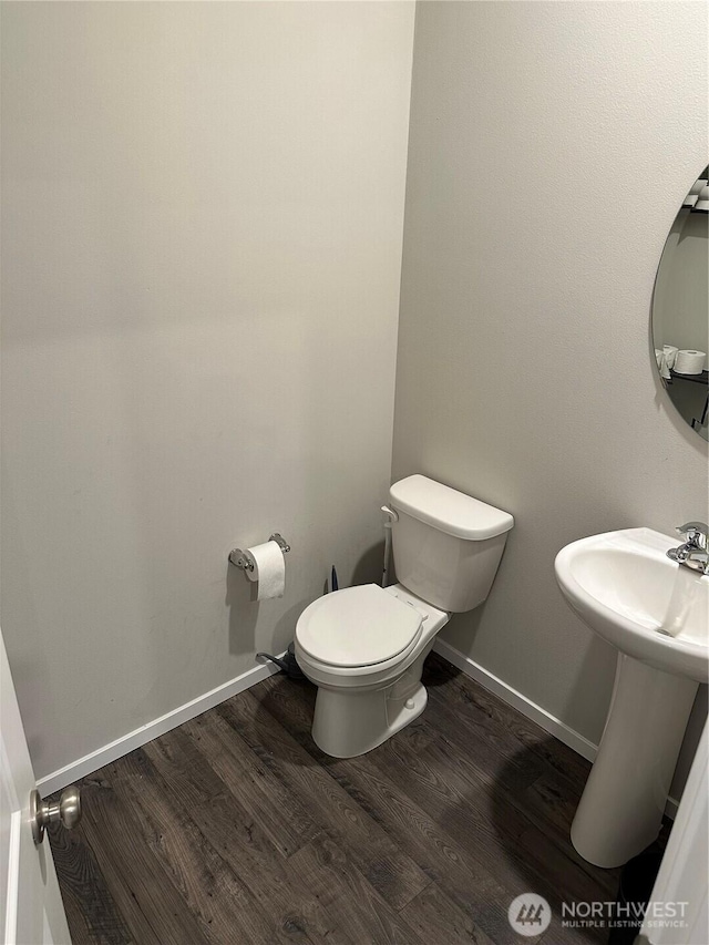 10823 187th Street Ct E, Puyallup, WA 98374 - bathroom with wood finished floors, toilet, and baseboards