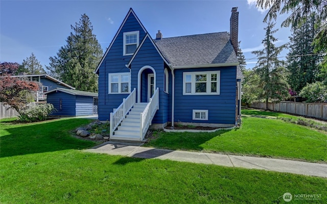 view of front of house featuring a chimney and a shingled roof