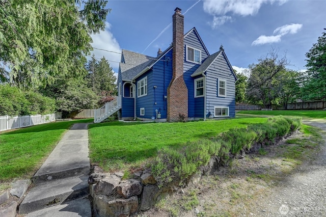 view of home's exterior with a chimney and a shingled roof