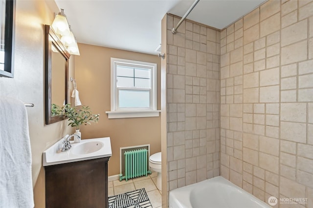 bathroom featuring radiator, tile patterned flooring, bathtub / shower combination, toilet, and vanity
