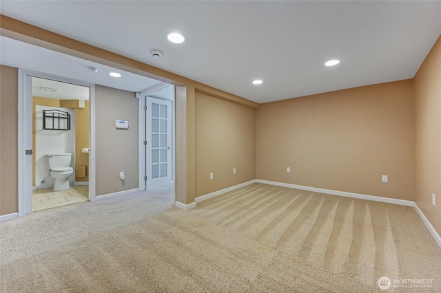 unfurnished room with light colored carpet, baseboards, recessed lighting, and a smoke detector