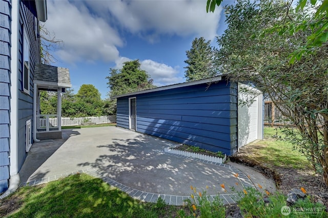 garage with fence