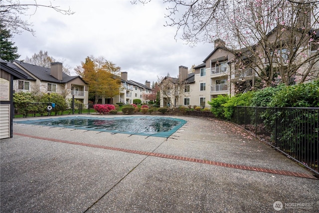 12303 Harbour Pointe Blvd Unit U202, Mukilteo, WA 98275 - community pool featuring fence, a residential view, and a patio area