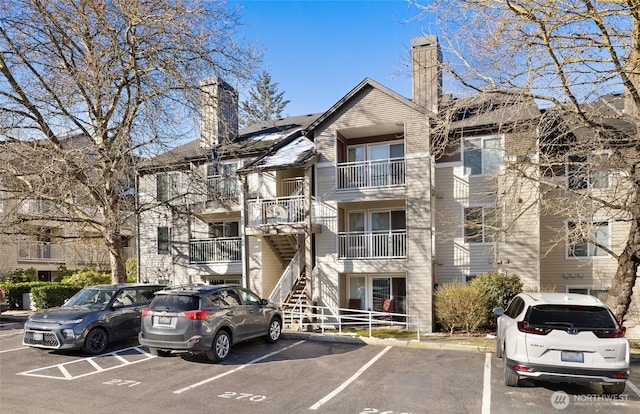 12303 Harbour Pointe Blvd Unit U202, Mukilteo, WA 98275 - view of building exterior with uncovered parking