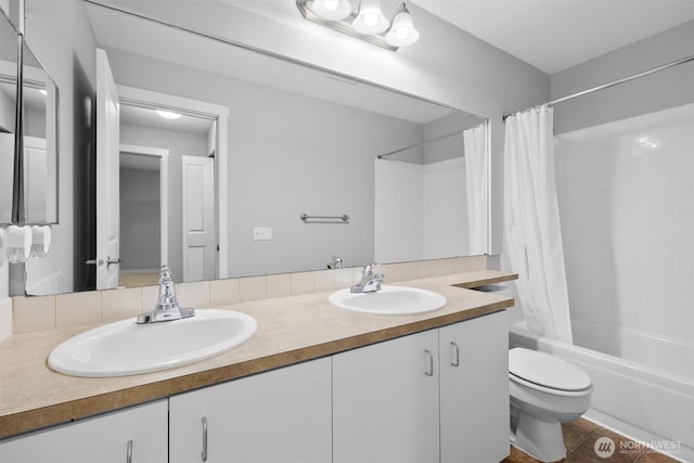 12303 Harbour Pointe Blvd Unit U202, Mukilteo, WA 98275 - full bath featuring toilet, shower / tub combo, double vanity, and tile patterned floors