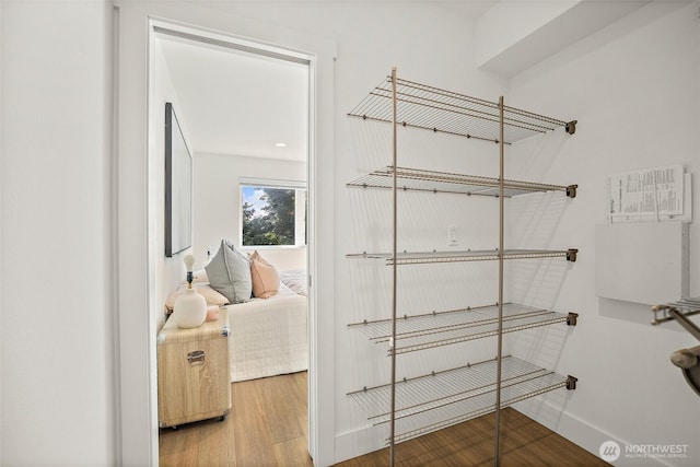 spacious closet with wood finished floors