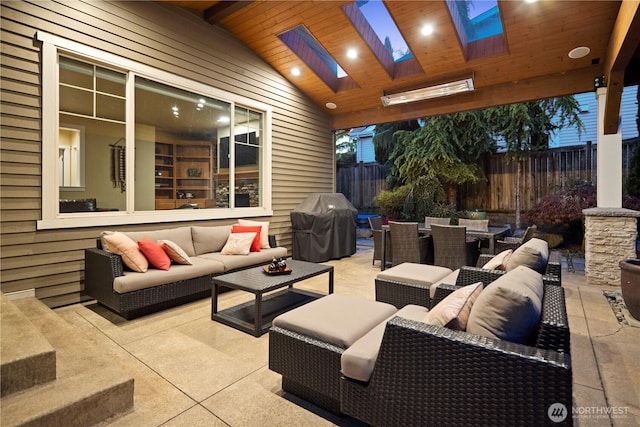 view of patio featuring an outdoor hangout area, area for grilling, outdoor dining area, and fence