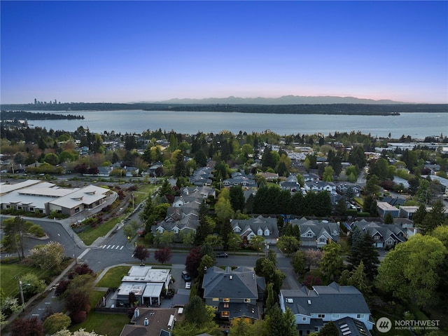 aerial view featuring a residential view and a water and mountain view
